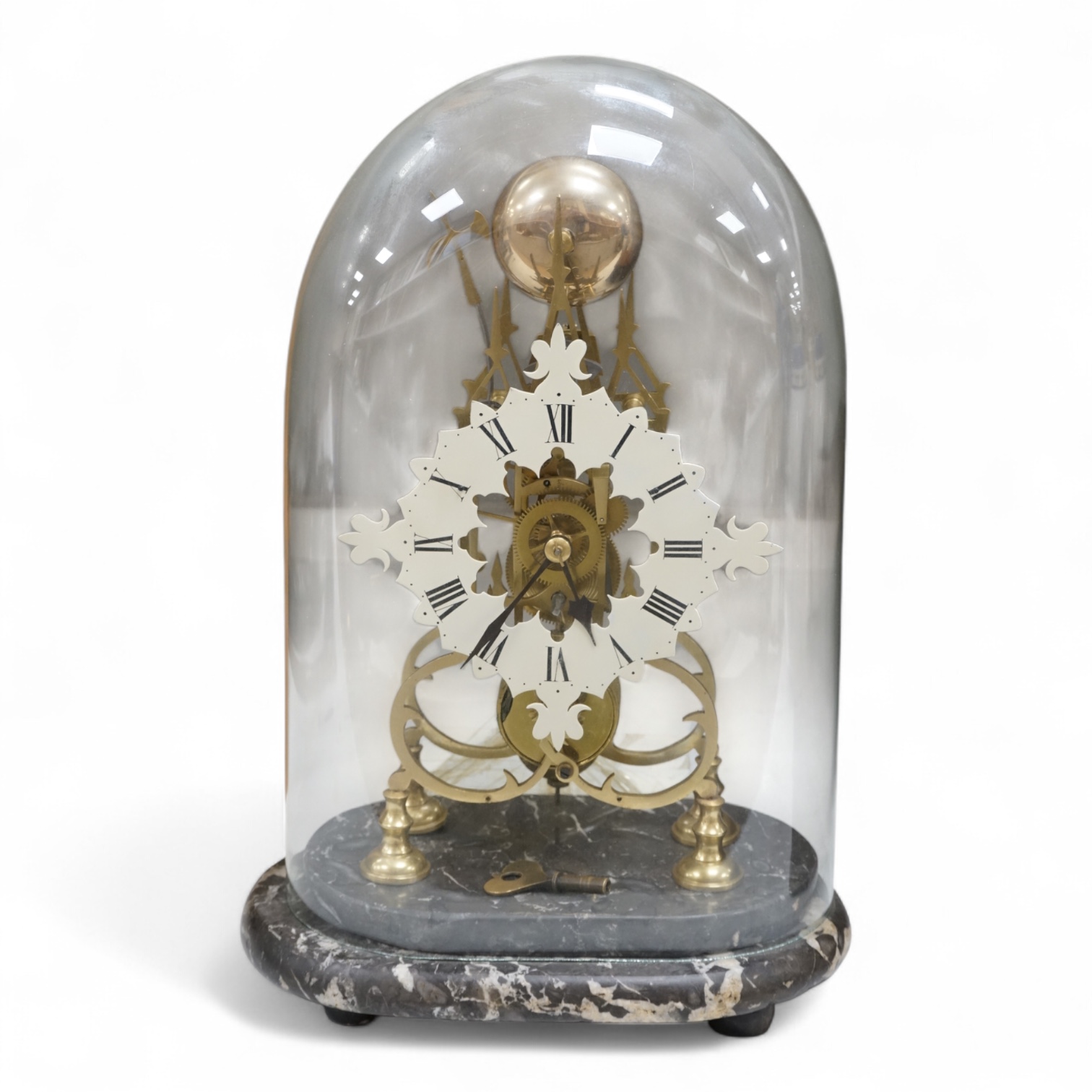 A large skeleton clock under dome, on grey marble base. 44cm high